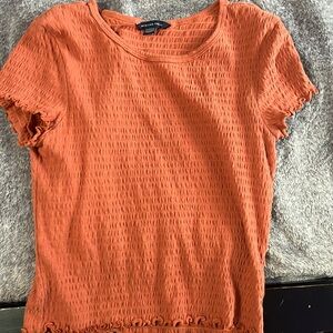 American Eagle coral shirt that has ruffles on the sleeves size extra small